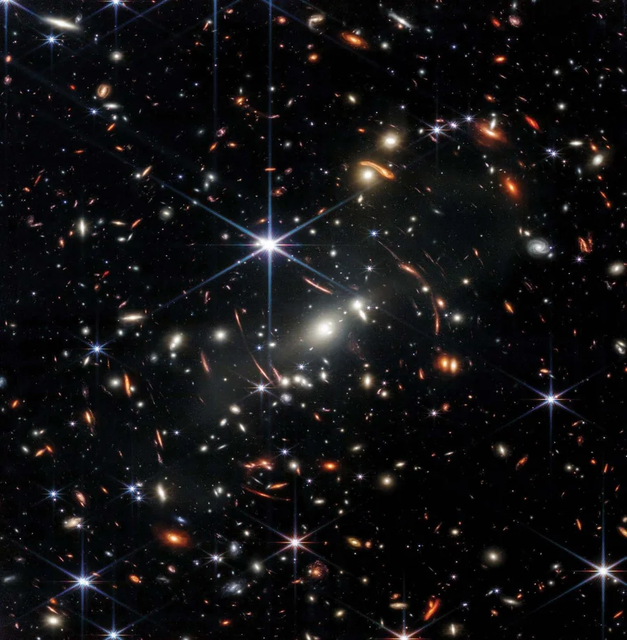 Galaxies from the depths of cosmic time appear in a small crop from “deep field” observations taken by the James Webb Space Telescope (JWST). The most distant objects in such images may reveal surprising new details about the early universe. Credit: NASA, ESA, CSA and STScI