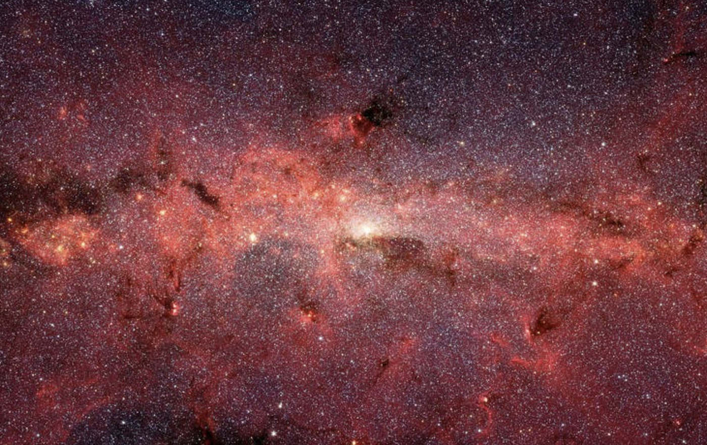 A cosmic scene showing stars and dense clouds of gas in galaxies