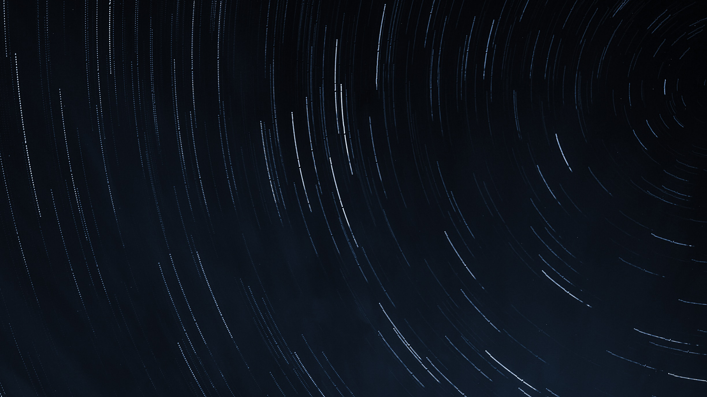A night time sky with blurred stars 