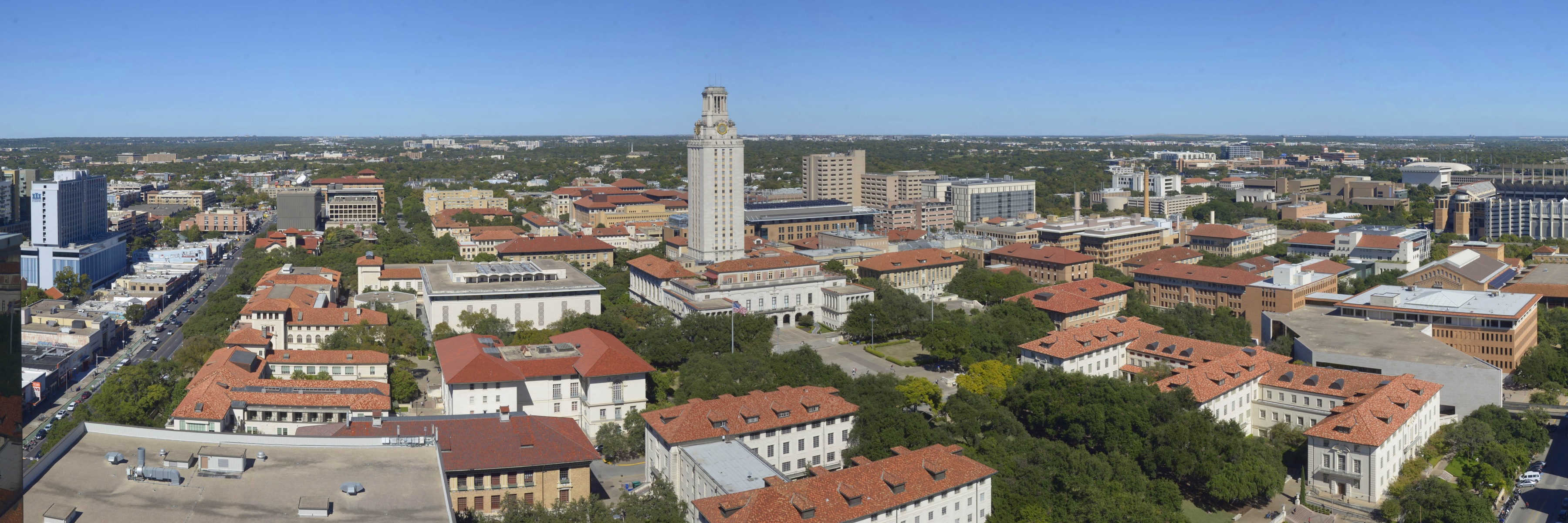 An aerial view of the UT Campus shows the Tower, the six-pack and buildings and greenery across the Forty Acres.